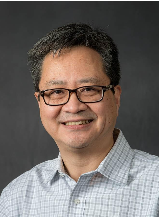 Man smiling with glasses